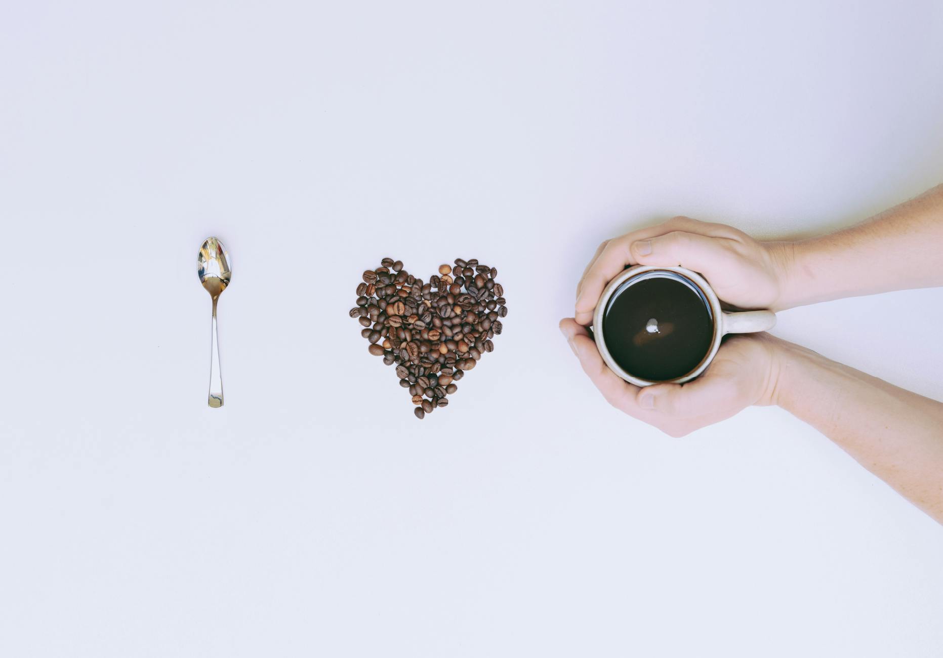 flat lay photography of mug and coffee bean
