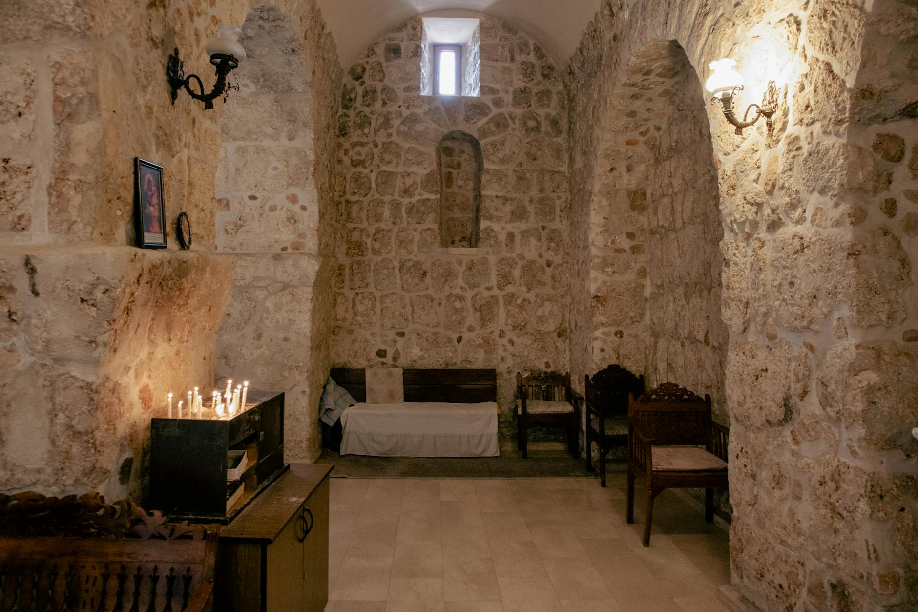 ascetic monastery room with arched stone walls