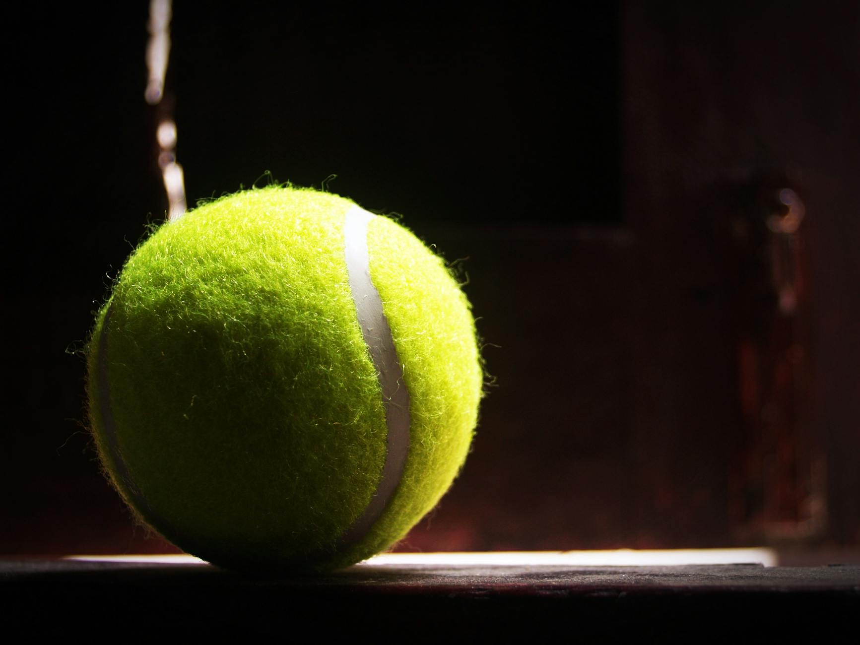 green lawn tennis ball