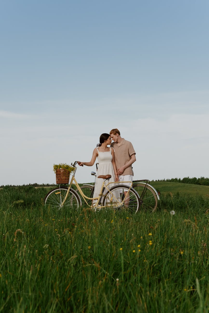 a couple on a grass field