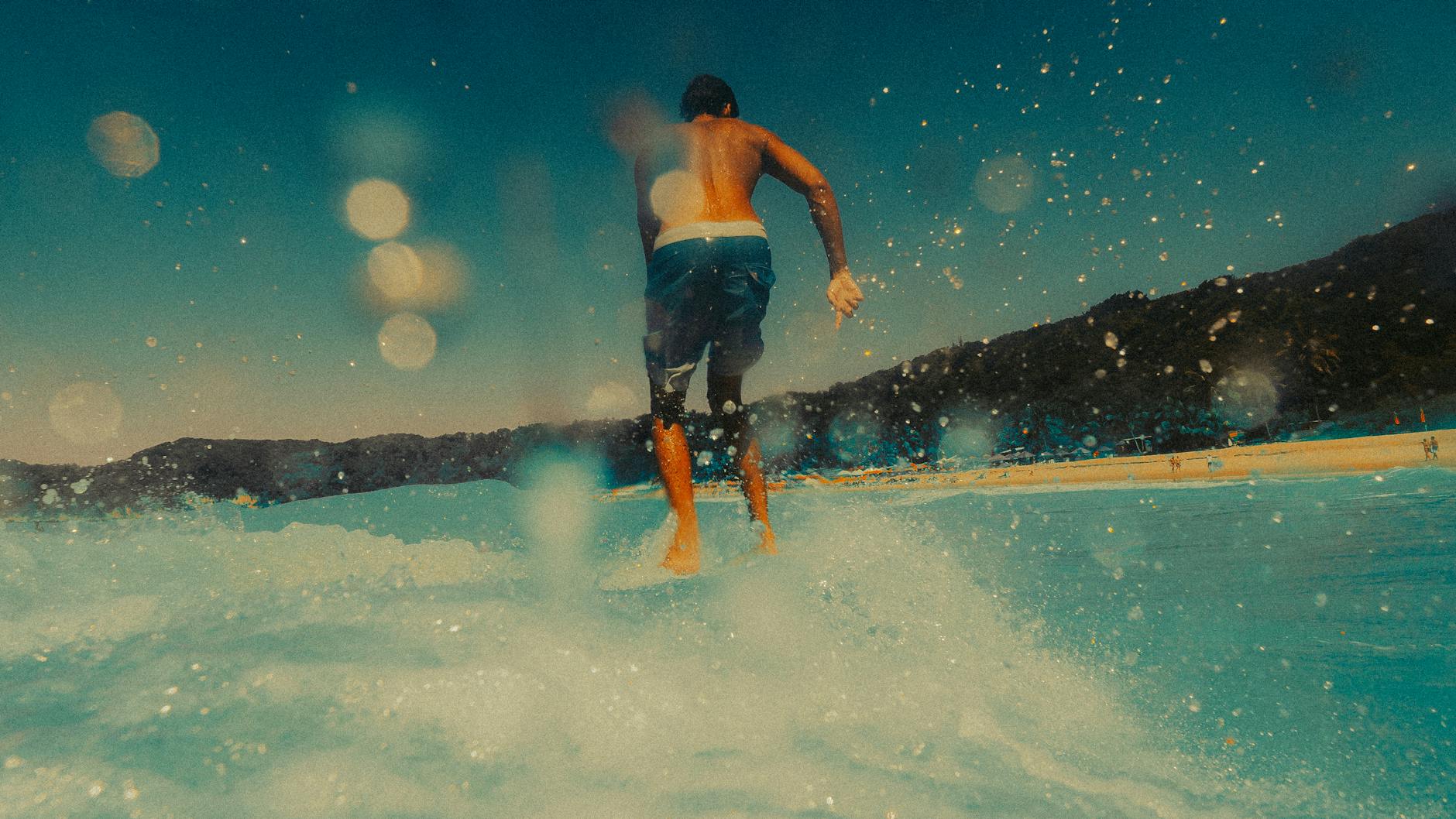 back view of a man surfing