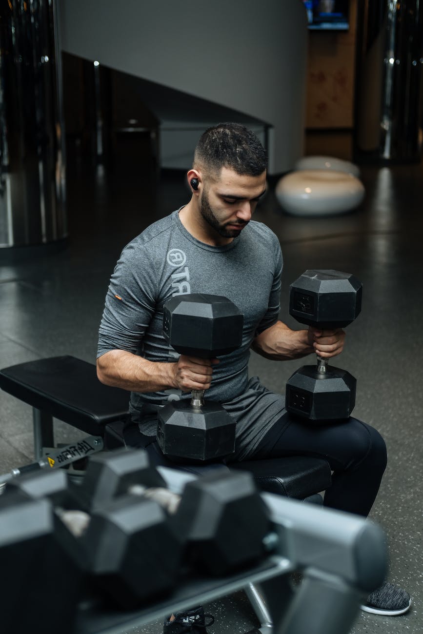 man sitting on flat bench