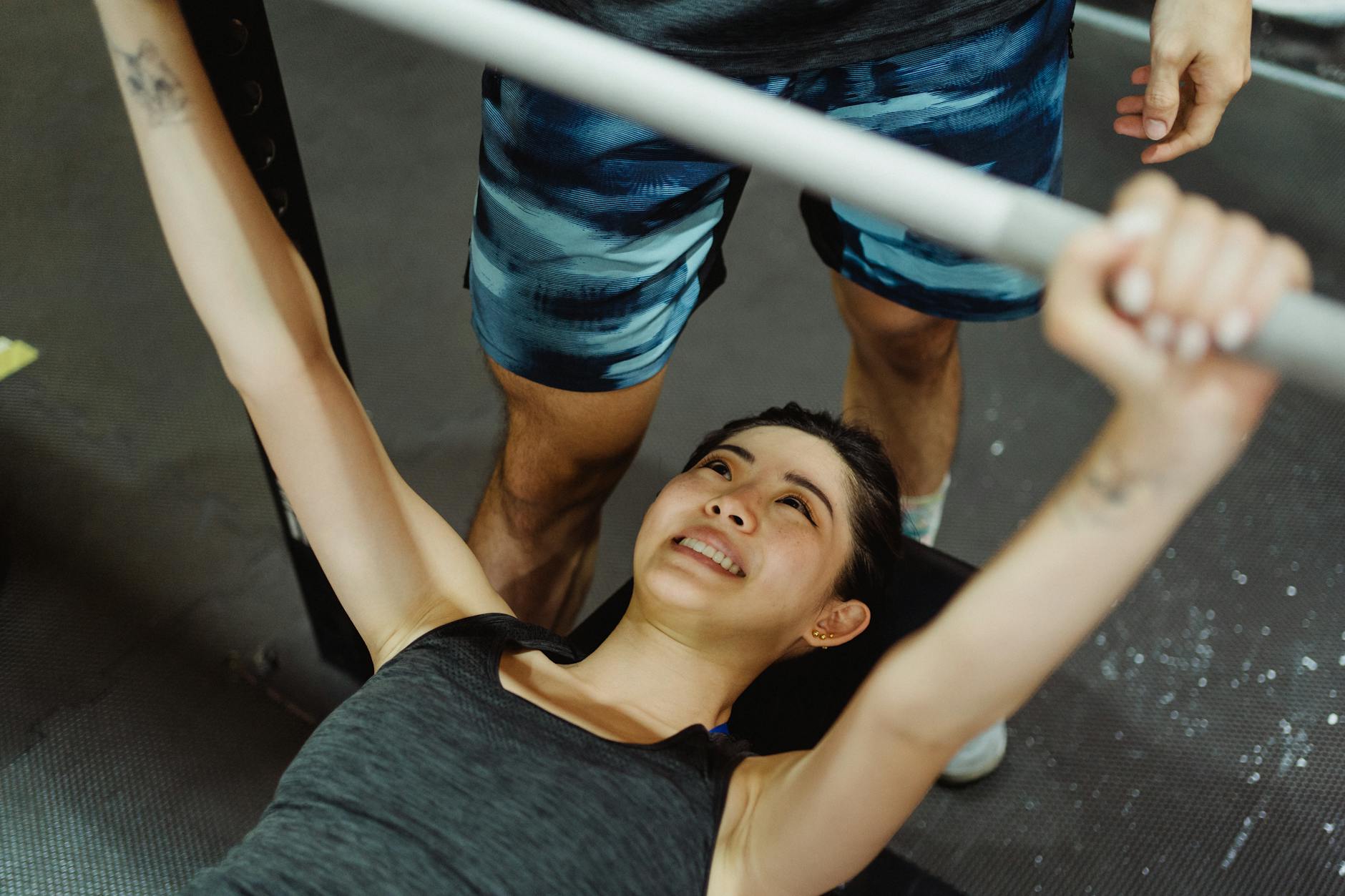 overhead shot of a woman doing bench press