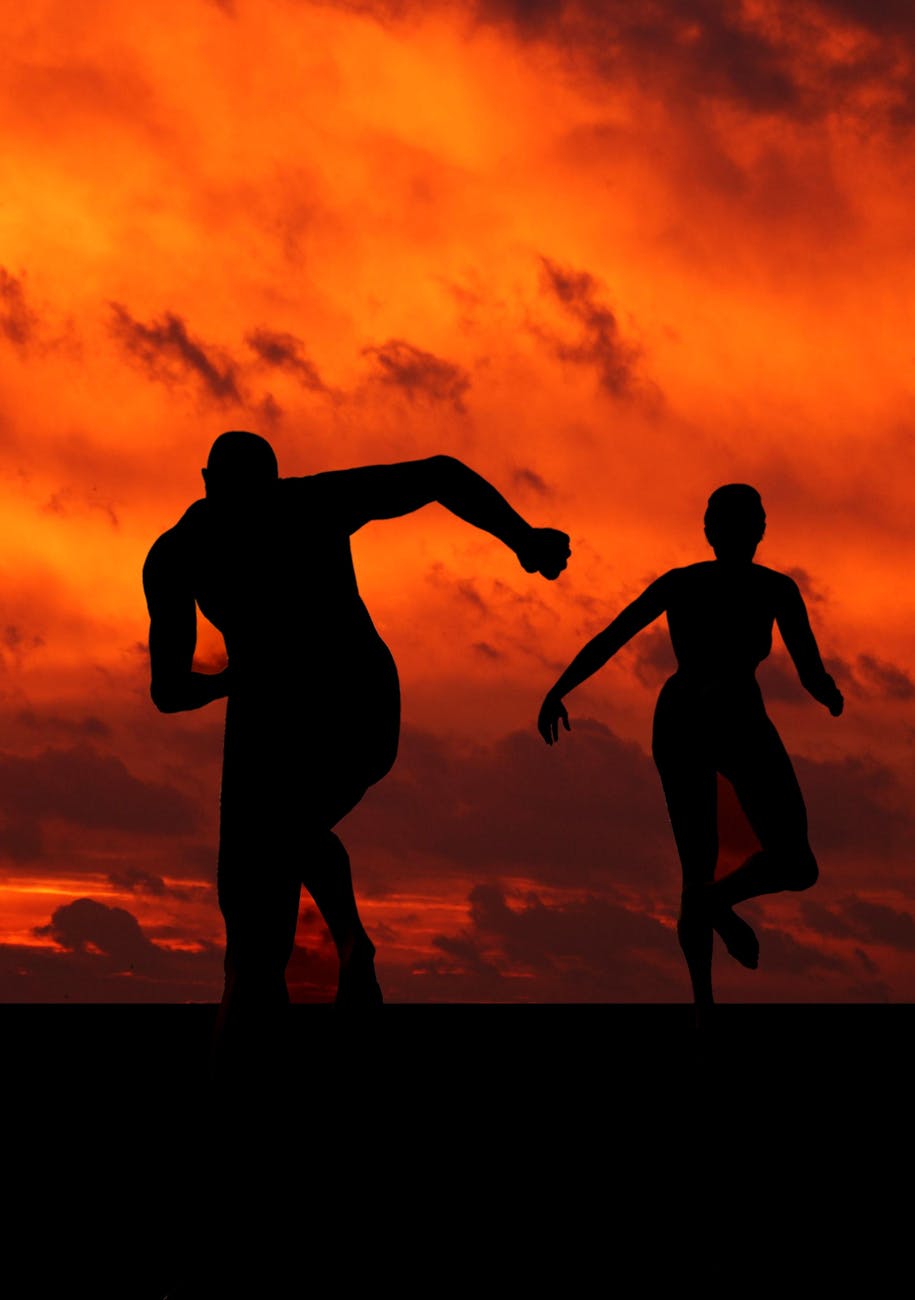 man and woman running silhouette