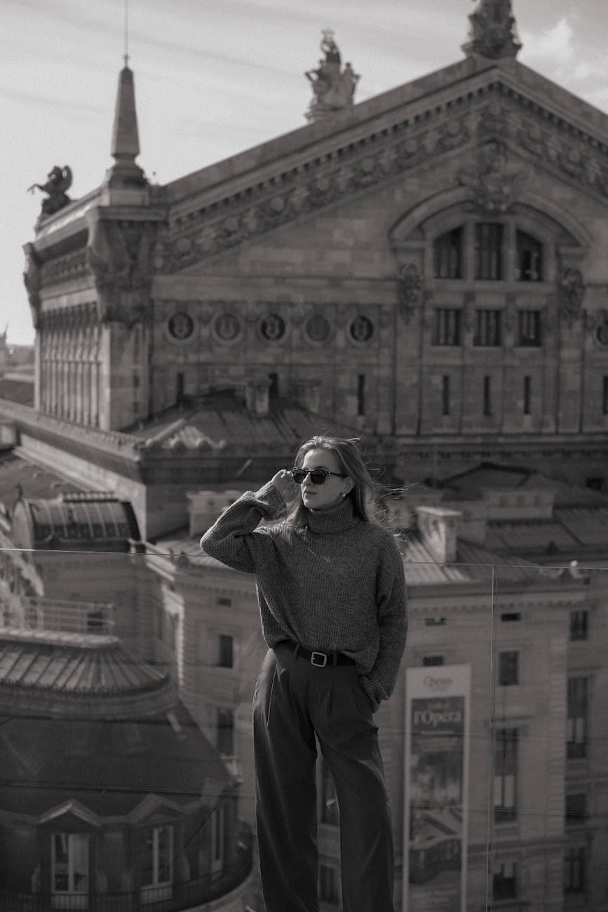 a woman standing in a city