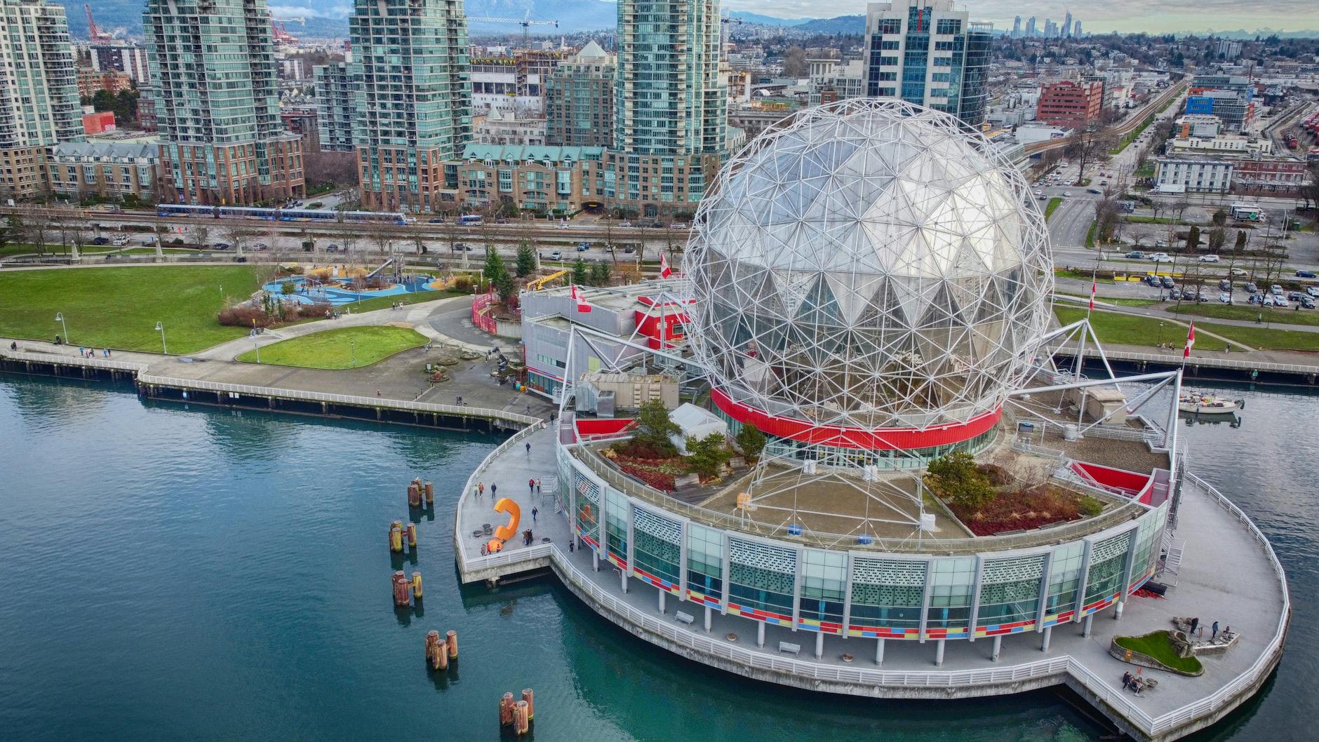 science world in vancouver surround by turquoise water of false creek